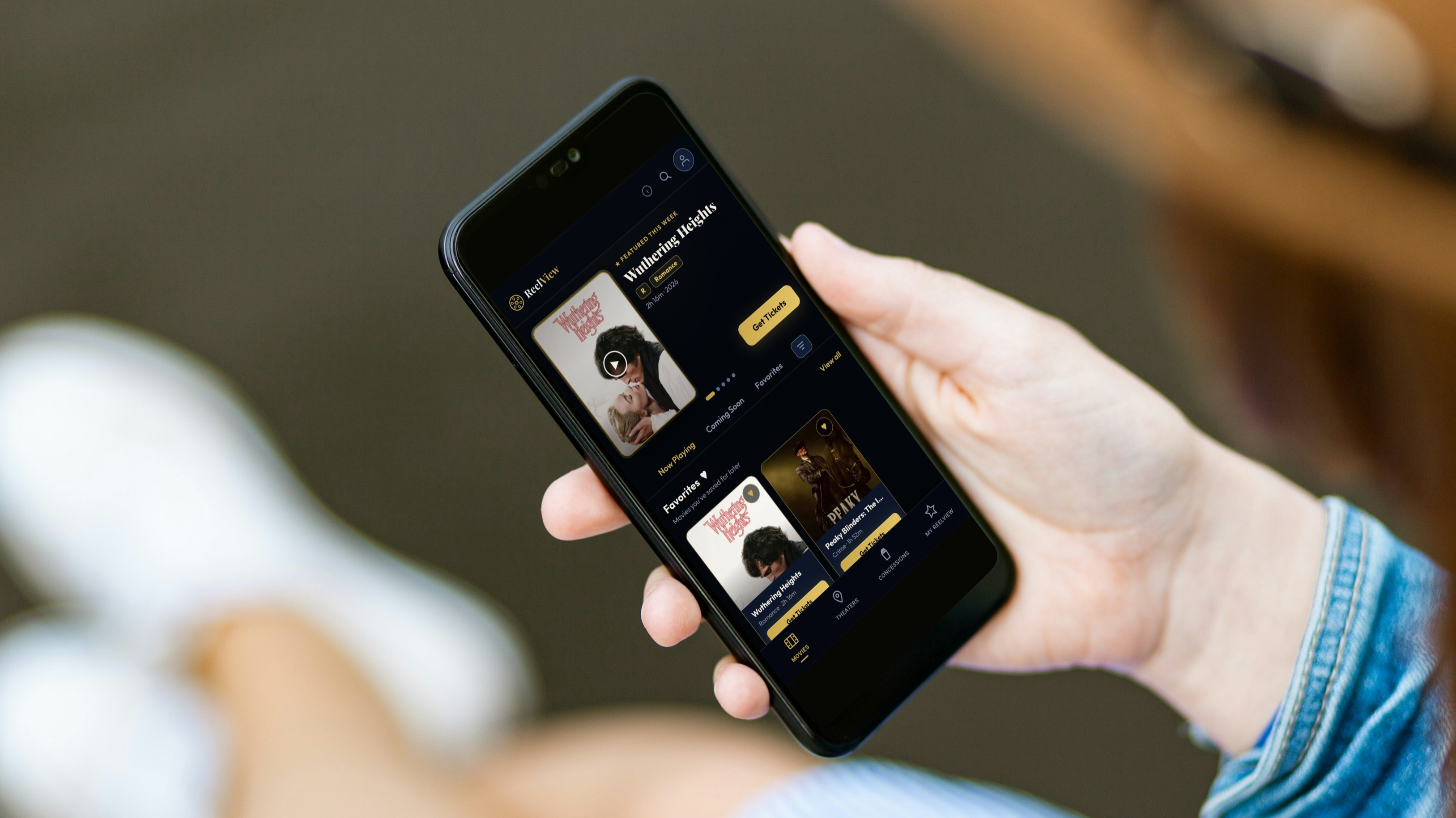 A montage of ReelView v2 phone screens — movie discovery, seat map with 3D POV, rewards-integrated checkout, and Tell-a-Friend confirmation